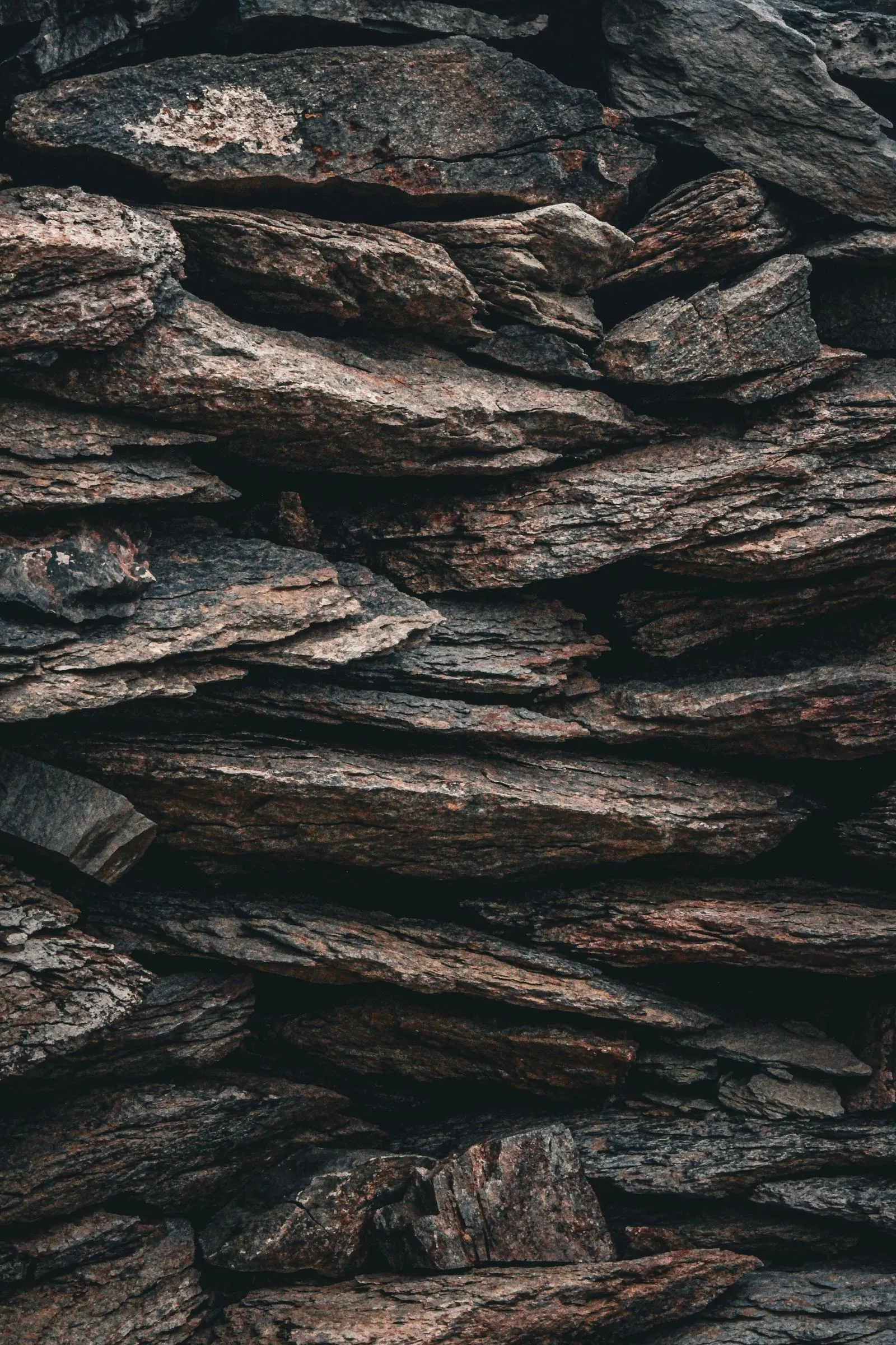 Stacked rock wall with earthy natural tones