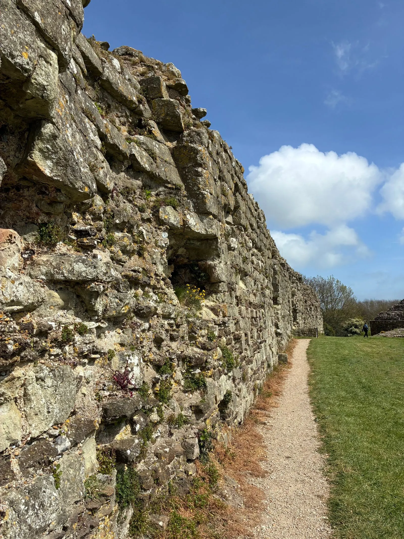 Ancient stone wall under a bright spring sky