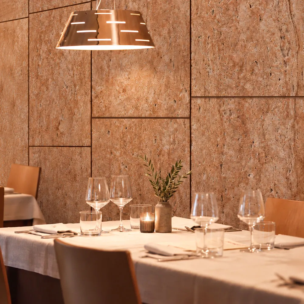 Restaurant dining area with a stone feature wall